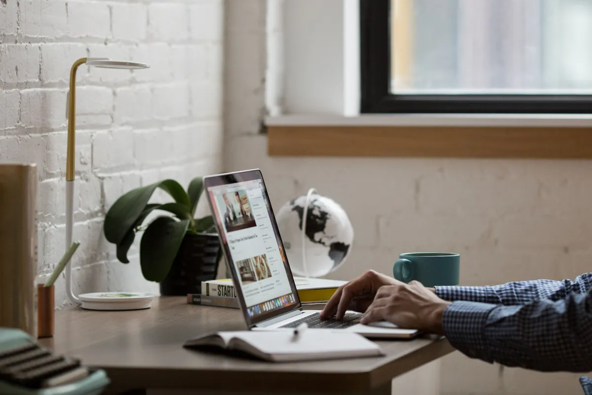 A person browsing the web on a laptop
